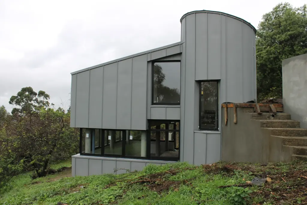 fachada curva zinc quartz Vivienda Unifamiliar en A Coruña